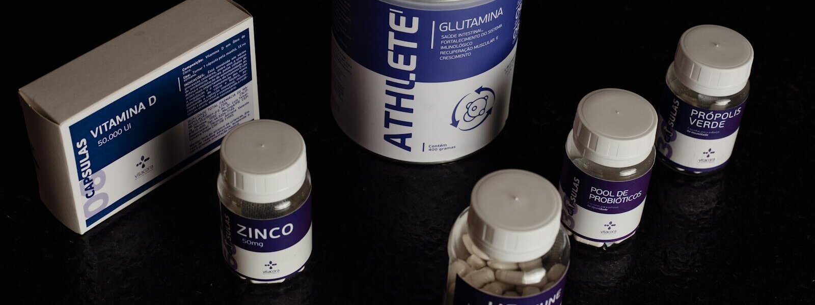 Close-up of a variety of nutritional supplements, vitamins, and probiotics.